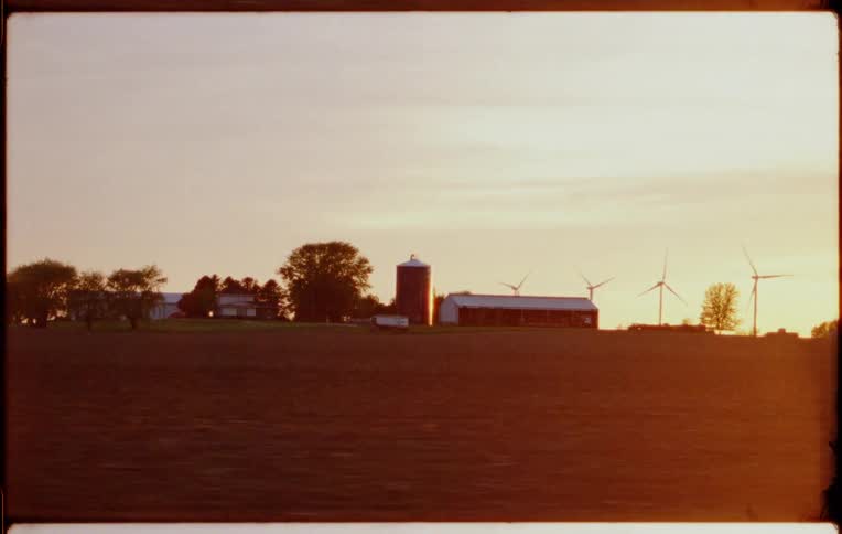 The windmills line the back of the farm