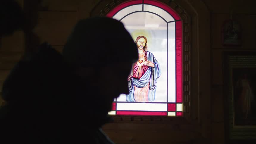 A man is praying in church