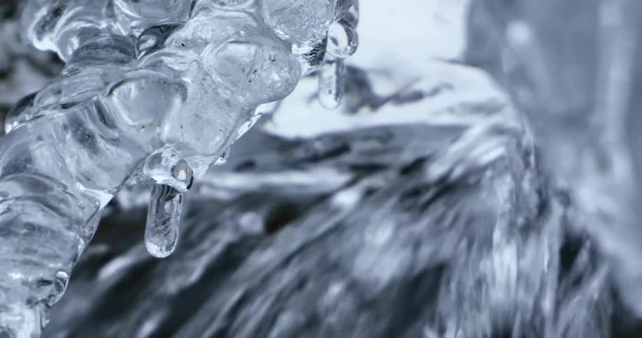 A waterfall with ice melting