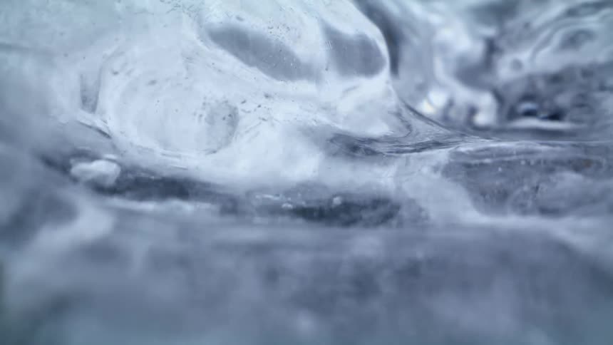 Water flows under translucent ice
