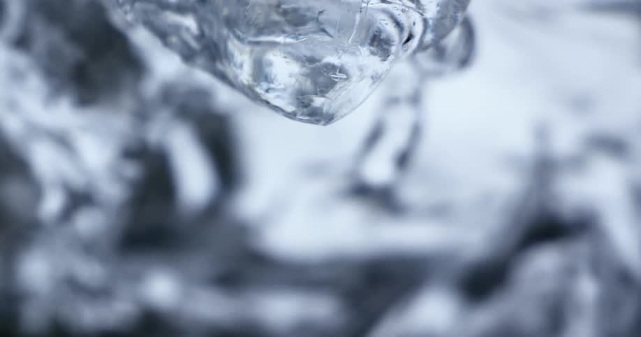A waterfall with ice melting