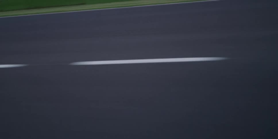A road next to signs and grass