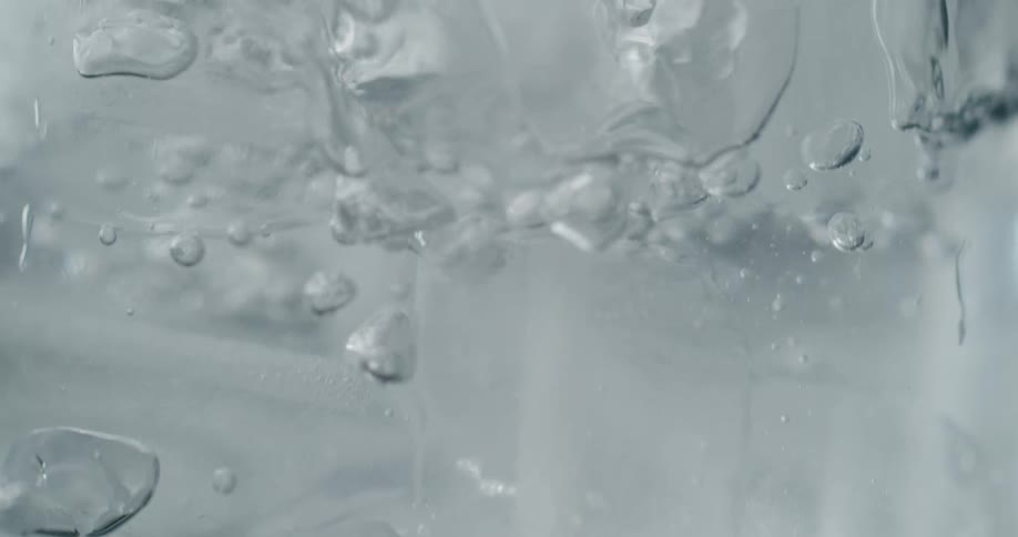 Liquid being poured over ice