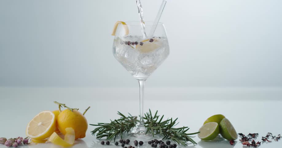 Liquid being poured in to a cocktail set up for a photo shoot