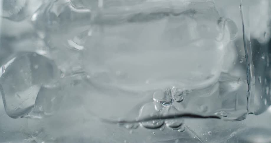 Bubbles floating in freezing ice water