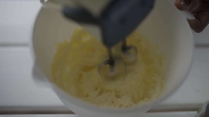 A hand mixer is used to cream a batter