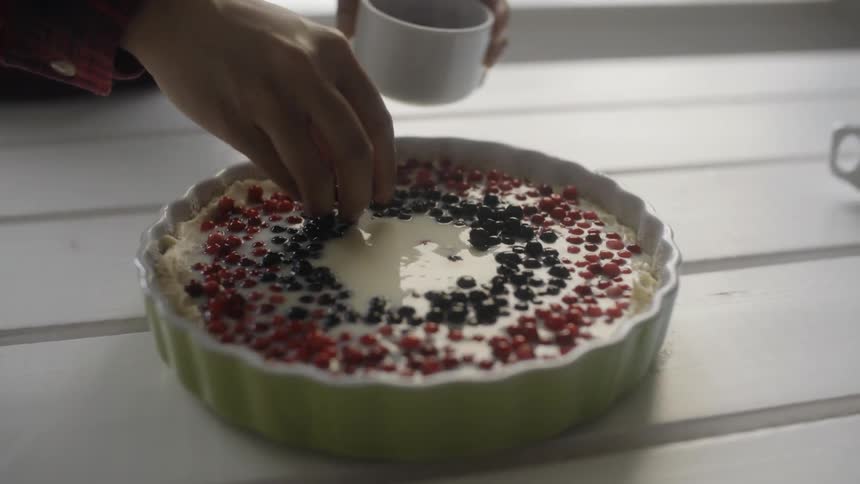 A person decorates a dessert