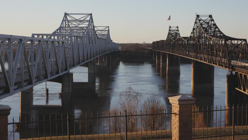 Vehicles drive over the double bridge
