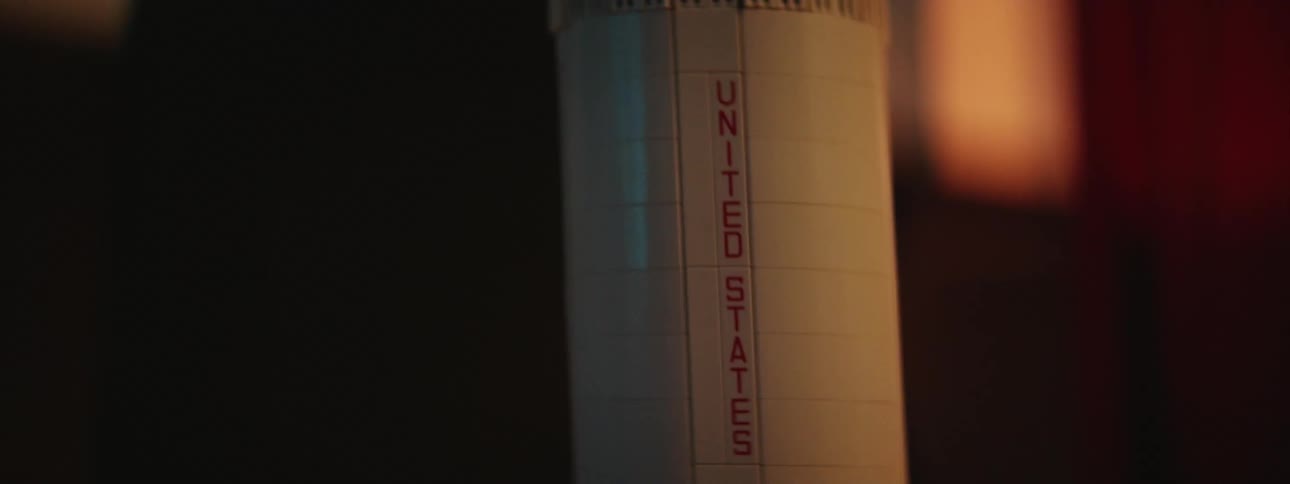 A small toy rocket ship with the words unite states written on it
