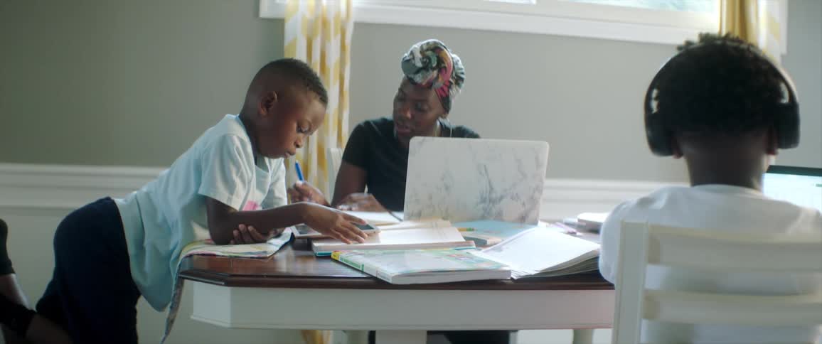Children do homework at the table