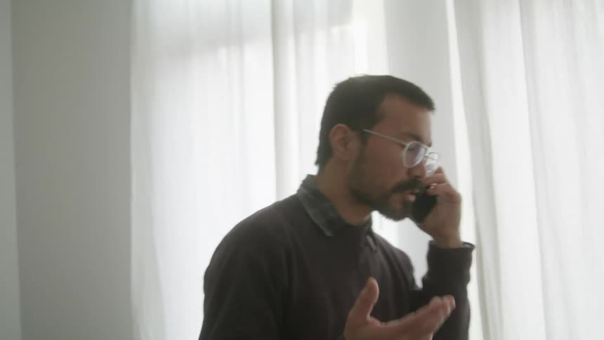 A man is talking on the phone