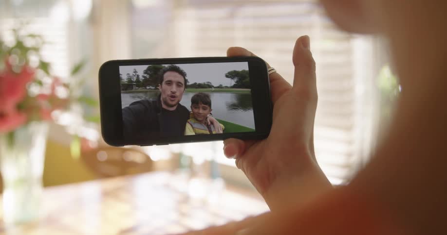 A person talking to other people on a smartphone