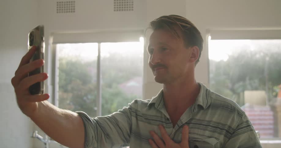A man talking to someone on a smartphone