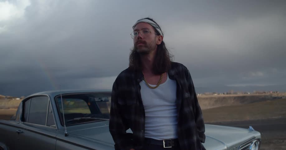 A man standing near a car