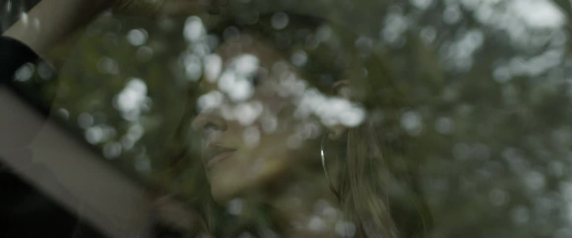 A woman staring out a window