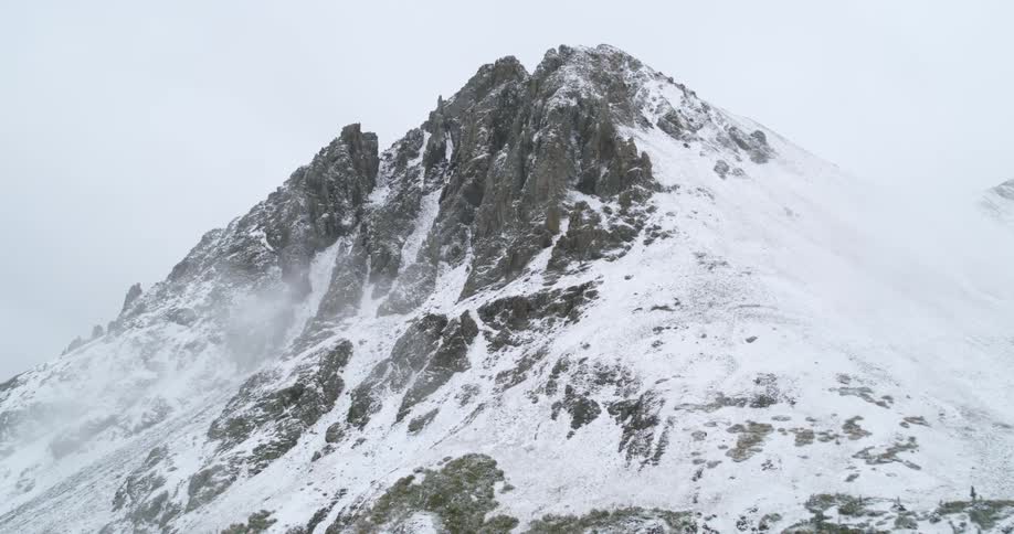 A mountain that has snow on it