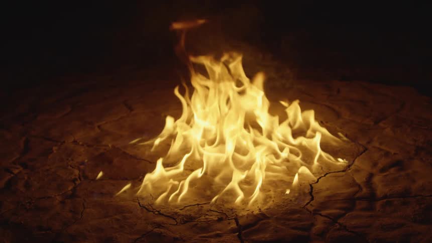 The fire is burning in the sand