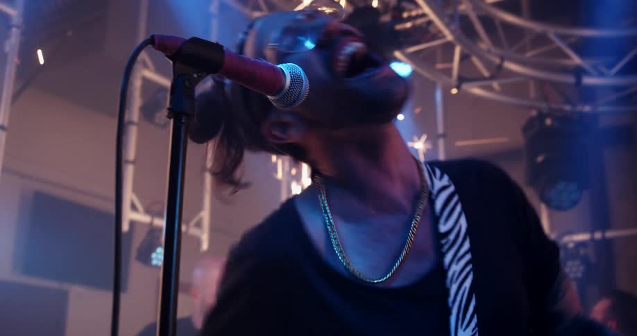 Rock band performs on stage near spouting sparkle effect