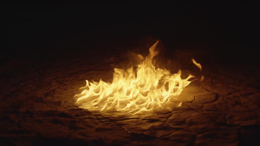 A fire burning on some soil