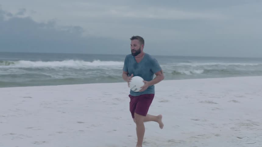 A man running down the beach