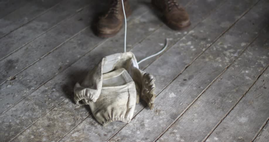 A person is standing with a rope by their feet
