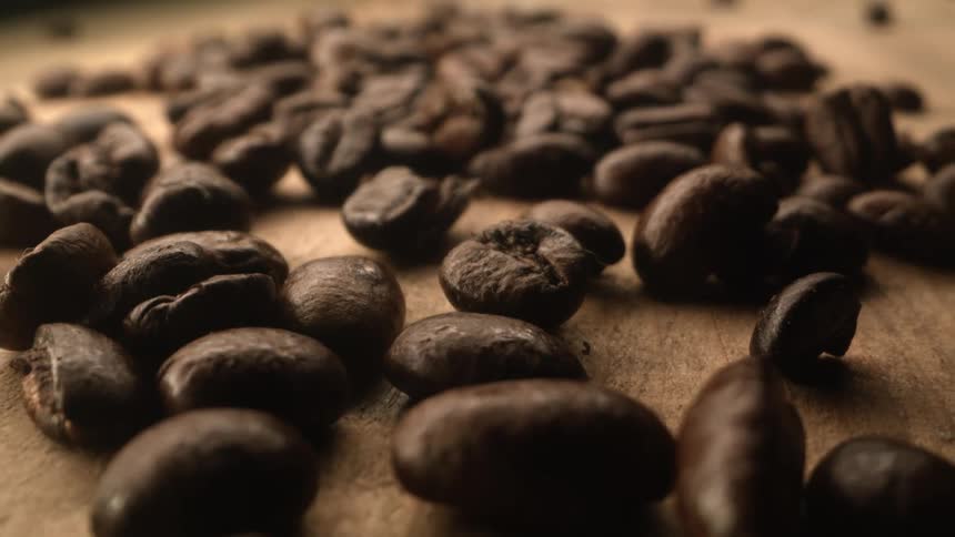 Coffee beans on a table made of wood