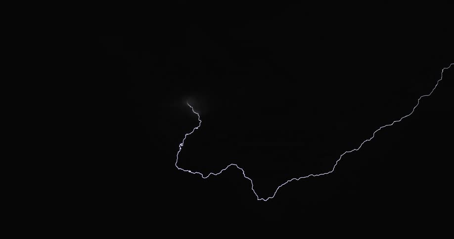 Lightning streaking arcs flashing over the silhouette of black clouds at night
