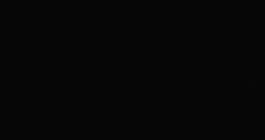Lightning flashes across the night sky