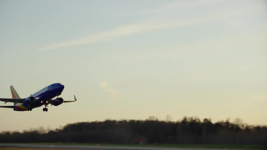 A brand new Boeing 737-Max lifts off from Paine Field at the Boeing Everett manufacturing facility in Washington State in soft golden evening light