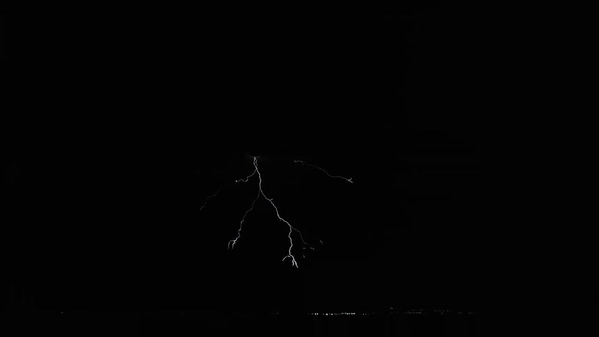 Lighting bolts flashing at night during a lighting storm in the country