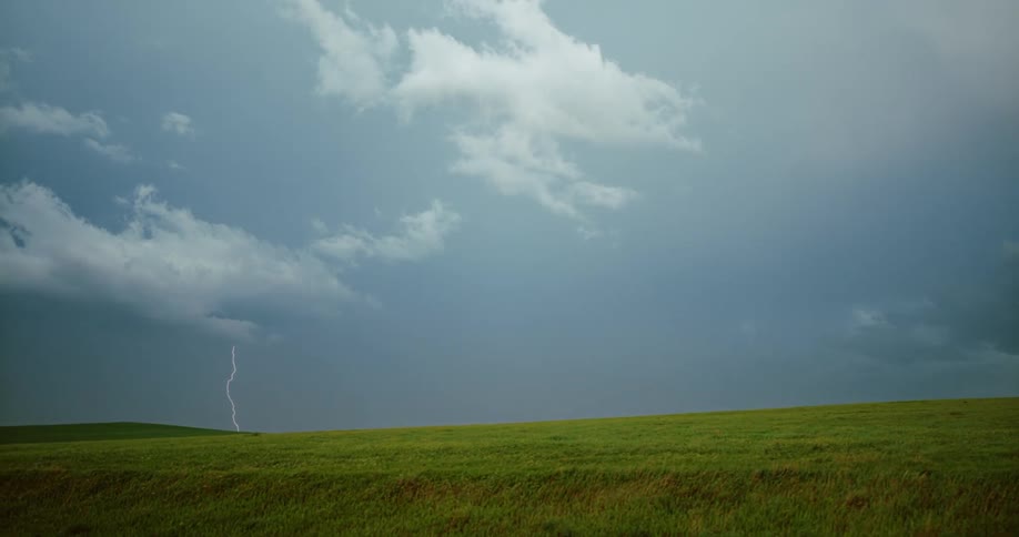 Lightning bolt flashes and hits the ground