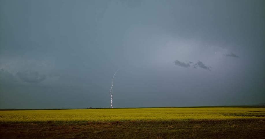 A landscape with a storm with lightning with the sky and clouds in the background
