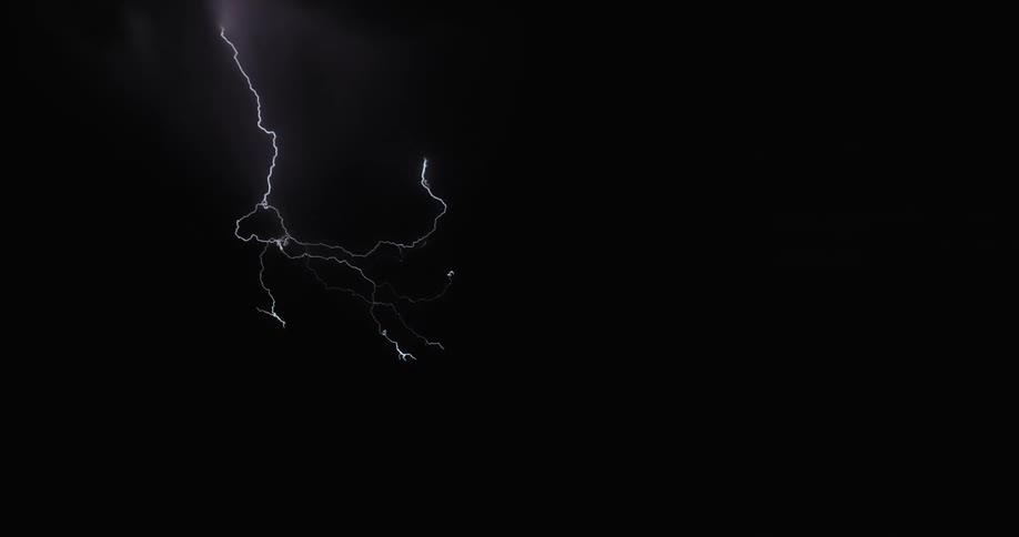 Lightning illuminating a dark sky during a thunderstorm