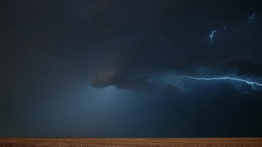 A storm with lightning with a landscape the sky and clouds in the background