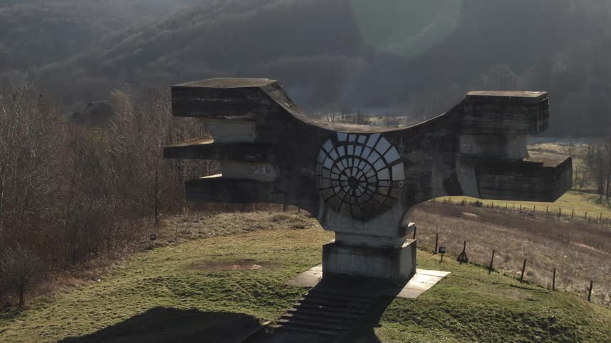 A large concrete sculpture on a field