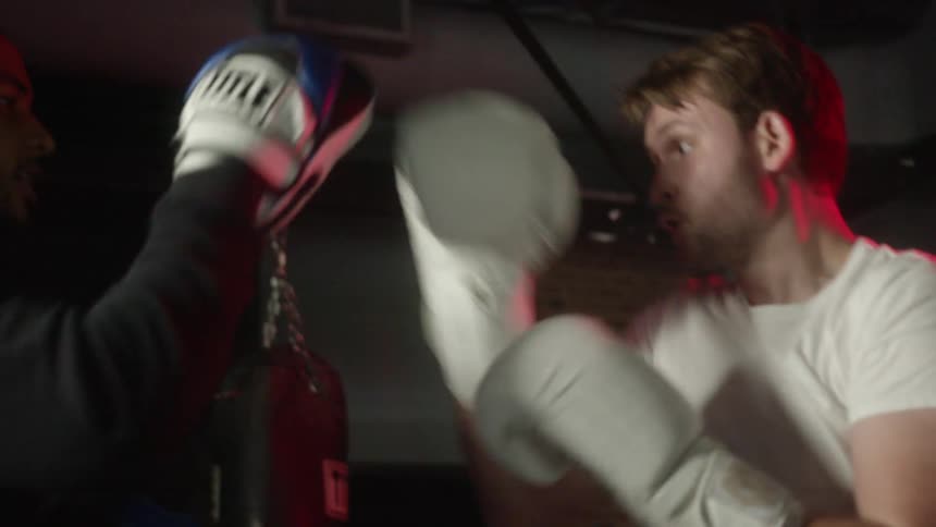 Two males boxing with each other