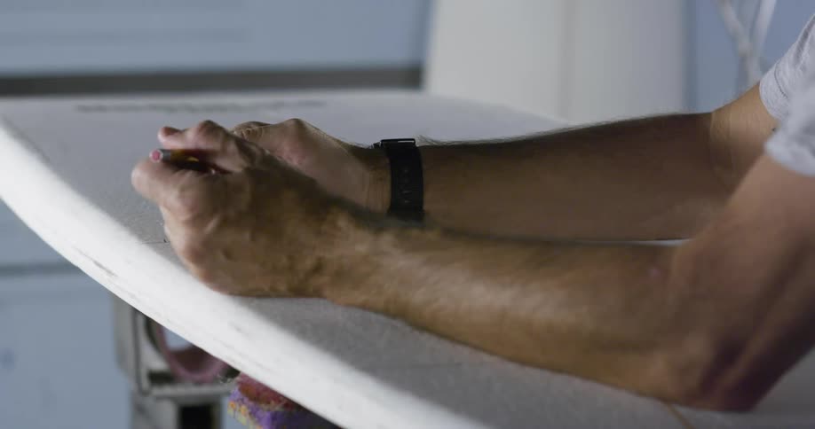 A man fidgeting with a pencil