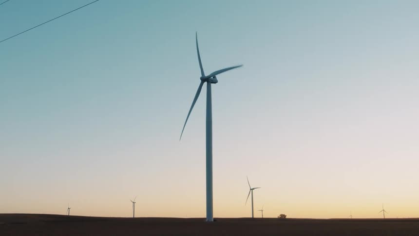 Wind turbines in a wind farm at sunset