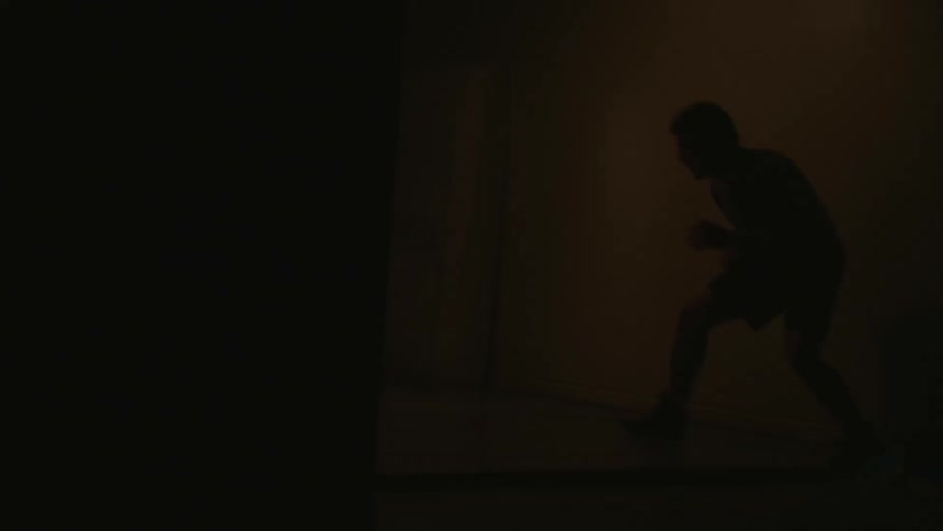 A man exercises indoors