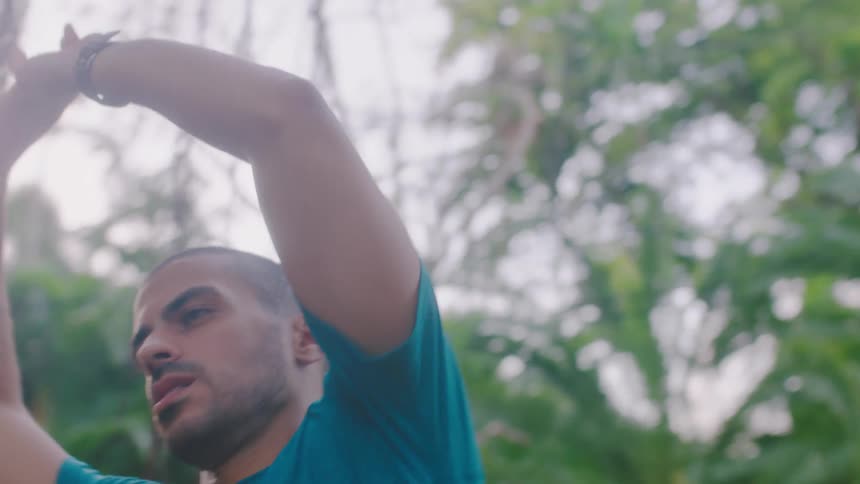 A man stretching outside