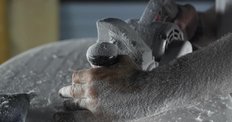 A man adjusts a power tool