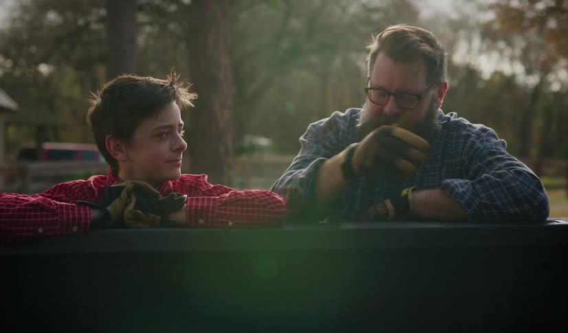 A father talking to his son outside