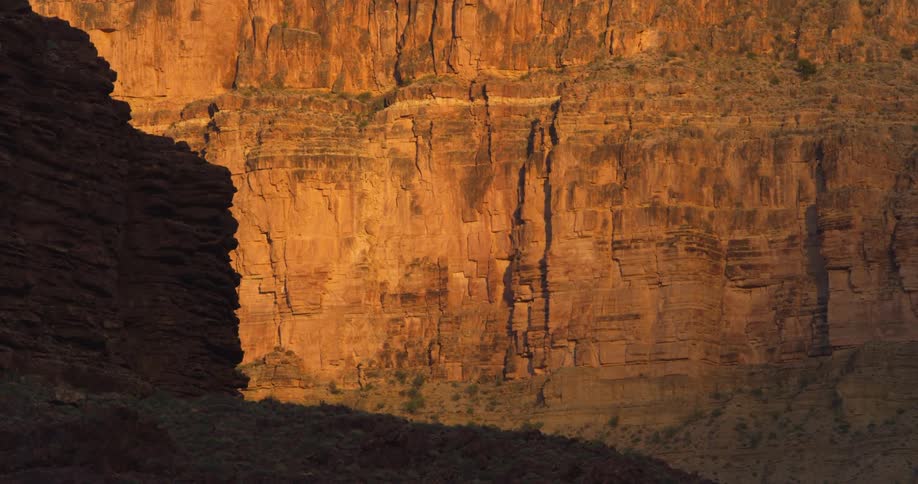 The last light of day illuminates sandstone cliffs deep within the Grand Canyon of the Colorado River in this static shot