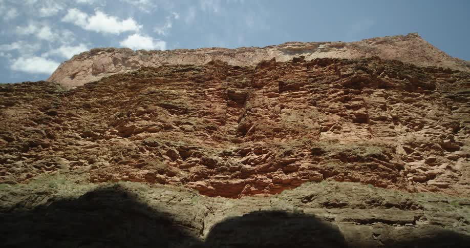 Looking up thousands of feet to the upper canyon rim from Colorado River level while whitewater rafting on the Colorado River in Grand Canyon National Park