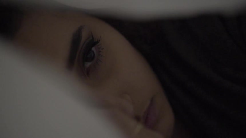 A woman is sleeping then slowly wakes
