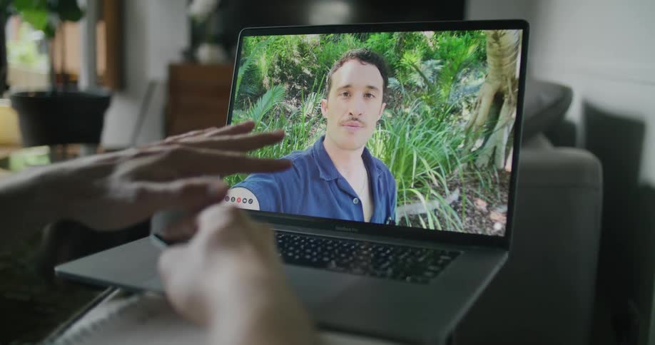 A man on a computer screen on video