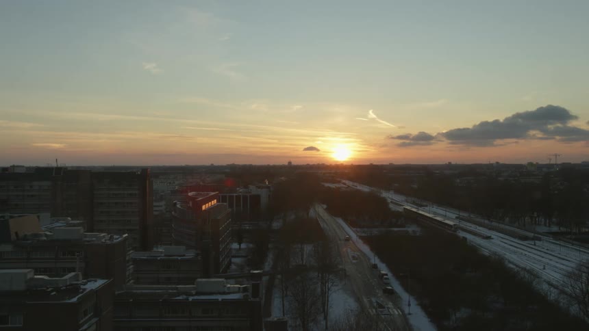 An aerial view of a city at sunset