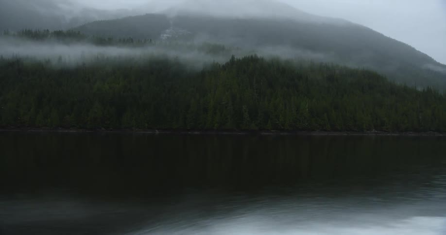 A view of a mountain range next to a lake