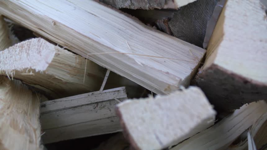 Pieces of chopped fire wood piled up outdoors