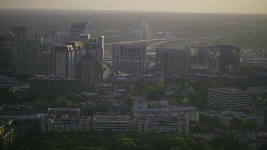 A city with many trees shown in sunlight